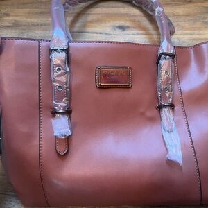 Brown Mosiso bag. Brand new—never used. Given as a gift, but wasn’t my style.